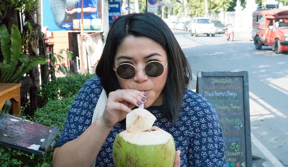 Corinne enjoying her refreshing coconut beverage.